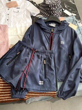 MIUMIU trench coat paired with Shorts features excellent tailoring L